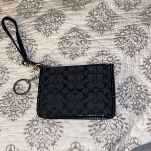 Black Coach credit card/ID zipper pouch.